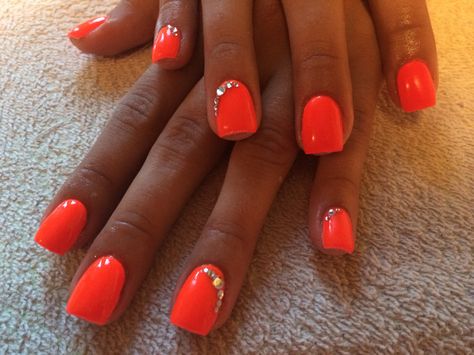 Neon Orange Nails With Glitter, Neon Nails With Gems, Bright Neon Orange Nails, Orange Nails With Rhinestones, Mcbling Nails, Neon Coral Nails, Bright Orange Nails, Nails With Gems, Nails With Charms