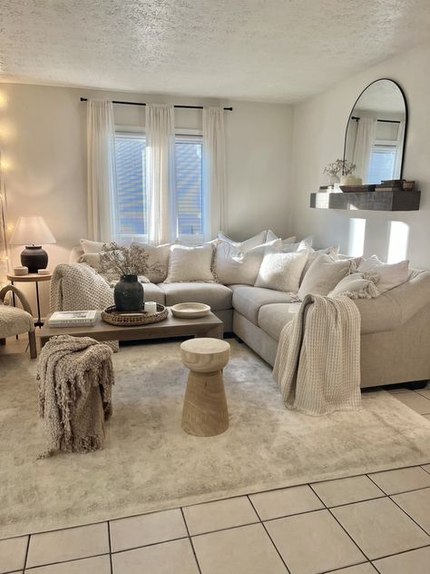 Beige, Cream, White, Living Room Decorating. Neutral Concept for Small Living Room Breaking rules: over the sofa mantel and too many pillows, no color. Over the couch shelf . Awkward small sectional decorating Cream Colored Sofa Decor, Neutral Aesthetic Home Decor Living Room, Cream Couch Decorative Pillows, Neutral Living Room Corner Sofa, Comfy Cream Couch, Neutral Corner Sofa, Small Cream Living Room, Cream Sofa Styling, Living Room Designs Cream Couch