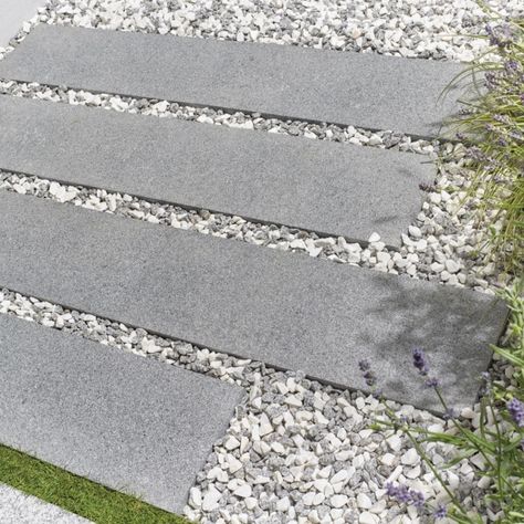 The Granite Rectangular Paving Slabs from Kelkay are a premium paving material and feature all the natural characteristics of granite; from high strength to low maintenance and finished in a stunning contemporary grey. #gardenoasis #gardeninspo #gardenaccessories  #summergarden #wintergarden #landscapingideas #gardenersworld #gardening #horticulture #garden #gardenlife #plants #flowers #nature #gardendecor #paving #gardenslabs #pavingslabs #drivewayinspo #kelkay #graniterectangularpavingslabs Granite Slabs Garden, Backyard Extension, Horticulture Garden, Garden Slabs, Natural Stone Paving, Sandstone Paving Slabs, Contemporary Garden Furniture, Herb Garden Pallet, Granite Paving