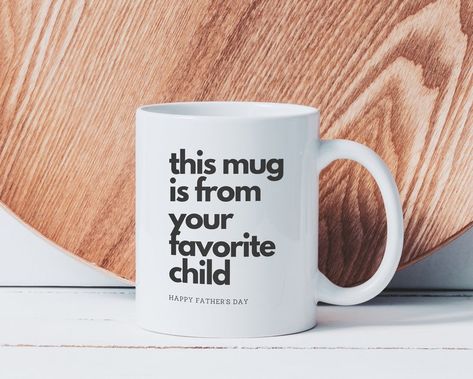 White ceramic mug with black words on it that say this mug is from your favorite child, happy father's day.  The mug is sitting on a white wood like floor and has a natural wood plate behind it. Unique Fathers Day Gifts Ideas, Cheap Fathers Day Gifts, Bible Board, Circuit Crafts, 1st Fathers Day Gifts, Cup Decorating, Fathers Day Ideas, First Fathers Day Gifts, Diy Father's Day Gifts