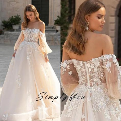 Exude elegance and grace on your special day with our Princess Wedding Dress. This enchanting gown features delicate lace appliques adorning the off-the-shoulder neckline and cascading down the bodice, creating a romantic and timeless look. The puff long sleeves add a touch of whimsy, while the custom-made design ensures a perfect fit. Say 'I do' in style with this exquisite bridal gown, crafted to make your wedding day dreams come true. ⭐ For Custom Size, please send a message. For Example: Siz Mystical Wedding Dress A Line, Winter Wedding Dress Off The Shoulder, Whimsical Wedding Dress Sleeves, Cold Shoulder Wedding Dress Long Sleeve, Boho Wedding Dress Puffy Sleeves, Southern Wedding Dress With Sleeves, Fluffy Sleeve Wedding Dress, Flowy Wedding Dresses With Sleeves, Wedding Dress Off Shoulder Long Sleeve