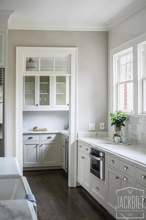 Kitchen Pantry Doorway with Transom Window and at the end of a window wall with fridge next to it. fridge is not flush with pantry door. not sure if i like that Snug Kitchen, Scullery Ideas, Modern Chateau, Hampton Kitchen, Kitchen Pantry Doors, Pantry Layout, Hamptons Kitchen, Styl Hampton, Rivers Edge