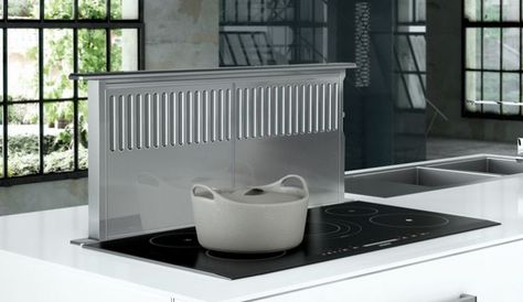 How to keep a kitchen looking open, airy, and well ventilated? Meet the range hood alternative, the pop-up stovetop vent. Oven Vent, Downdraft Vent, Island With Stove, Stove Vent, Range Vent, Kitchen Vent, Condo Renovation, Exhaust Hood, Hood Vent