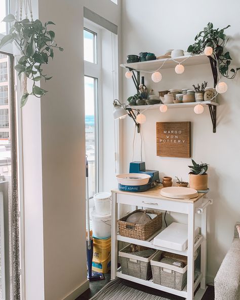 Mini pottery studio in my apartment ☺️ I live in a one bedroom downtown and so happy to have a little creative space of my own. Looking forward to the day I can have a proper studio, but love this space for now. I’ve learned to be efficient with space and always diligently clean to avoid any dust. #pottery #ceramics #artstudios #artspace #apartment #apartmentideas Balcony Pottery Studio, Pottery Studio Style Bedroom, Small Pottery Studio At Home, Pottery Space At Home, Pottery Corner At Home, Home Pottery Studio Workspaces, Pottery Set Up At Home, Apartment Pottery Studio, Small Home Pottery Studio