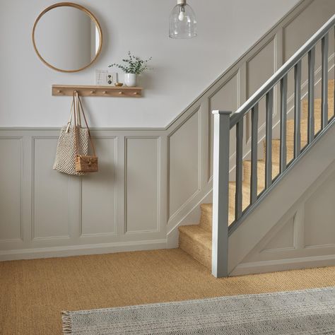 Need some hallway inspiration or wall panelling ideas? Take a look at this neutral stair wall panelling. Decorative moulding has been used to create texture in this luxury hallway design. Add neutral stair panelling, your favourite home decor, runner rug, oak coat pegs and oak flooring to complete your traditional wallway design. Lambriseringen Gang, Stairs And Hallway Ideas, Stair Paneling, Entrance Hall Decor, Hallway Colours, Panel Ideas, House Staircase, Hallway Inspiration, Narrow Hallway Decorating