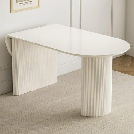 Enhance your dining area with the QEZEOM Folding Dining Table, a versatile and space-saving solution designed to accommodate 4 to 8 people. This modern rectangle dining table in white is perfect for kitchens and small dining rooms, offering flexibility with its foldable design. Whether hosting a family dinner or entertaining guests, this table expands effortlessly to meet your needs while maintaining a sleek and contemporary appearance. Dining Table Desk Combo, Kitchen Table Small Apartment, Small Kitchen Nook Table, Dining Table Studio Apartment, Table That Expands, Dining Table Attached To Kitchen Island, Small Corner Dining Table, Kitchen Table For Small Spaces, Small Oval Dining Table