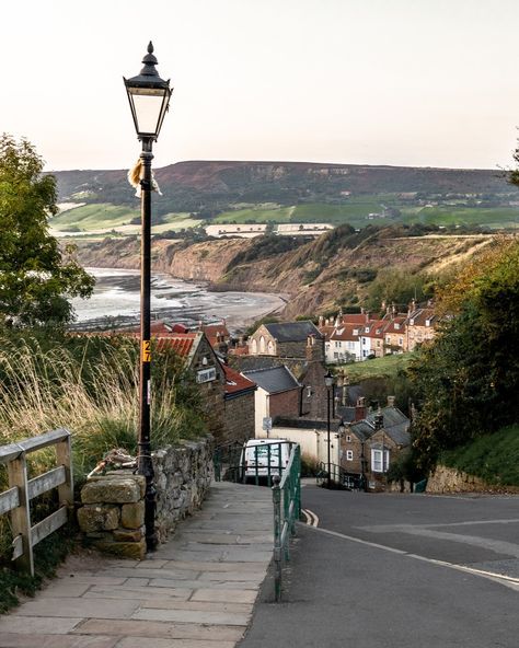 ELISE 🧿 UK TRAVEL & LIFESTYLE on Instagram: “Beautiful views over Robin Hood's Bay. I flew Marvin (the drone) over the coastline here, and loved the view. Sometimes, I wish I could be…” Nature Town Aesthetic, Summer In Uk, Robins Hood Bay, England Village Aesthetic, Robin Hood Bay England, Cottage In Lake District, Robin Hood’s Bay, Uk Life, Robin Hood’s Bay England