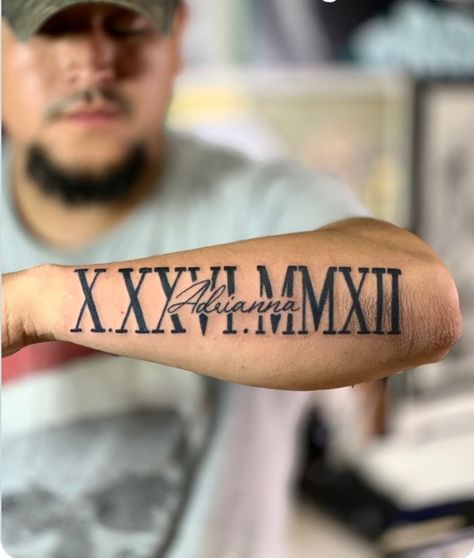 Roman Numerals And Name Tattoo, Roman Numeral With Name Tattoo, Cool Name Tattoos Ideas, Birthdate Tattoo Ideas For Men, Name And Roman Numeral Tattoo, Date Tattoo Ideas Roman Numerals, Forearm Roman Numeral Tattoo, Birthday In Roman Numerals Tattoo, 2004 Tattoos