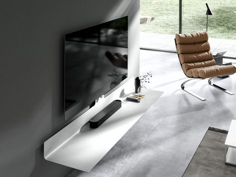 Air is an elegant and absolutely minimal collection of tv supports and lowboards, which float in the wall of your living room to offer the highest quality of design of the audio and TV furniture. The result of a skilful design signed by the Spectral brand.Airboard mounts serve as basic elements for TV, all types of soundbar, media player and wireless charging station for smartphones. The TV is mounted on the wall using means of TV or retractable TV stand. The solutions in the collection have a s Tv A Muro, Happiness Is Homemade, Cable Cover, Cable Box, Samsung Tvs, Tv Furniture, Smart Furniture, Smart Lighting, Sound Bar