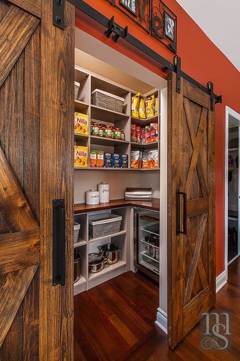 By utilizing the closet space in the adjoining home office, we were able to create a walk-in pantry accessed through the nook. Rustica weathered barn doors hide the large walk-in pantry housing more Subzero wine and beverage refrigeration. Log Cabin Walk In Closet, Walk In Pantry With Barn Door, Pantry With Island Walk In, Western Pantry Ideas, Country Pantry Ideas, Shop House Living Room, Barndominium Pantry Ideas, Rustic Walk In Closet Ideas, Rustic Walk In Pantry