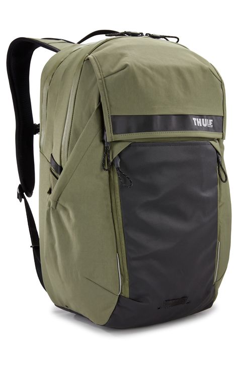 A well-organized interior makes this backpack an easy, convenient accessory for your daily commute to work or class. The tough nylon construction helps it hold up to wear and tear, and the padded, air-flow back panel promotes all-day comfort. Front expansion pocket holds helmet while off the bike or a jacket or extra pair of shoes while riding Large side pocket holds a water bottle or insulated container securely while riding or walking Integrated rain cover has an allover reflective coating offering full rain protection and exceptional visibility in low-light conditions Laptop sleeve fits most 16" laptops Shoulder strap shape and sternum strap position enhance stability while riding Nylon Imported Commuter Backpack, Commuter Bicycle, Rain Protection, Sac Lunch, Commuter Bike, Commute To Work, Bike Helmet, Rain Cover, Travel Backpack