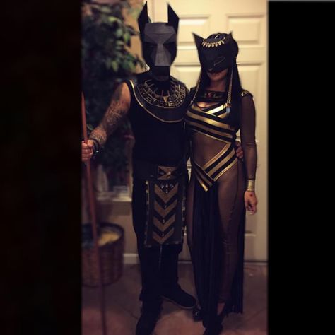 Couple Halloween costumes. Anubis and Bastet. Paper masks from Etsy. Egyptian Group Costume, Mummy Couple Costume Halloween, Anubis Halloween Costume, Egyptian Halloween Costume Couples, Bastet Goddess Costume, Cleopatra Halloween Costume Couple, Egyptian Couple Costume, Egyptian God Costume, God And Goddess Costume Couple