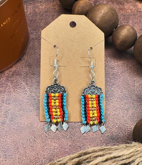 ✨ Western Beaded Earrings ✨ WE’RE BACK with another pair of super cute western style earrings you HAVE to have! 😍🩵 these gorgeous and uniquely designed beaded earrings go great with our western beaded chokers! Check them out on our website! Linked in our bio 🔗 #western #westernbeaded #westerncharm #westerncolors #bohowestern #cowgirlstyles Western Beaded Jewelry Baha Ranch Western Wear, Western Beaded Fringe Earrings, Western Style Seed Bead Earrings, Silver Southwestern Beaded Earrings, Southwestern Turquoise Beaded Earrings, Nickel Free, Style Earrings, Beaded Choker, Western Style, Western Fashion