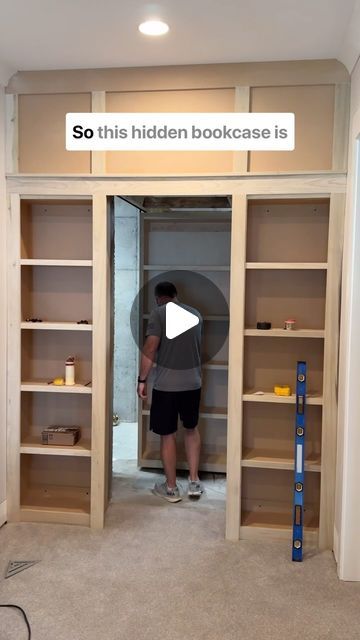 MT Trim Co. on Instagram: "This hidden bookcase door is on another level! It’s literally hanging from tracks that help it glide completely in and out of the opening! 

#hiddendoor #bookcase #slidingdoors #carpentryskills #interiortrim #customcabinets #slide #builtins" Built In Bookshelves With Hidden Door, Built Ins With Secret Door, Hidden Christmas Tree Closet, Hidden Track Sliding Door, Hidden Book Shelf, Hidden Bookshelf Door, Billy Bookcase With Doors, Hidden Bookcase Door, Diy Bookshelf Wall