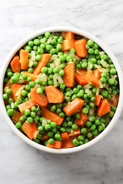 Peas and Carrots is a simple vegetable side-dish that pairs well with almost anything. Perfect for weeknight dinners, this colorful dish can also be served for Thanksgiving and Easter. This healthy recipe is very easy to make. A great way to use up the bag of frozen peas that's been sitting in your freezer for ages. #healthy #recipe #plantbased #carrots #peas Frozen Peas And Carrots Recipe, Peas And Carrots Recipe, Paleo Vegetarian, Peas And Carrots, Carrots Recipe, Burger Night, Colorful Dishes, Cooked Carrots, Pasta Dinner Recipes