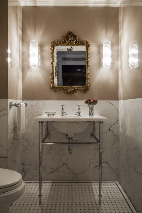 Great powder room  Always an elegant look to have marble going up to chair rail height.  Saves $ from doing a whole wall and you get to add color! Marble Half Wall Bathroom, Guest Bathroom Half Wall, Retro Marble Bathroom, Powder Room Tile Floors, Elegant Toilet Room, Half Tile Powder Room, Half Height Tiles Bathroom, Marble Floor Powder Room, Marble Powder Bathroom