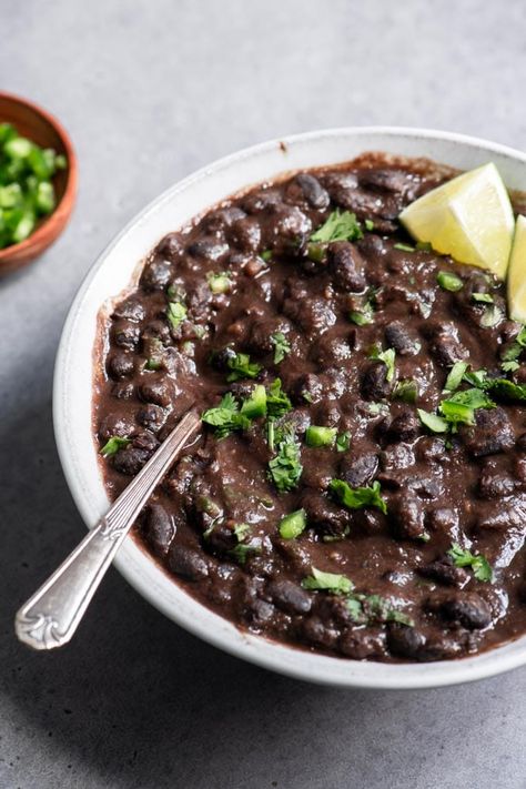 These cilantro and cumin seasoned black beans are easy to make and so incredibly flavorful. Enjoy them on their own, in bowls, tacos, burritos, enchiladas or more! Vegan Refried Black Beans, Cook Black Beans, Seasoned Black Beans, Pressure Cooker Beans, Vegan Refried Beans, Refried Black Beans, Homemade Refried Beans, Dried Black Beans, Black Bean Recipes