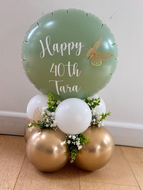 Create a stunning balloon display within minutes. These stunning balloons are great are a alternative to flowers and you can add your own personal touch. Each set includes: Green Sphere Balloon (18 to 22in) in Eucalyptus, Peach, Pink or Blue 6 11in balloons in white 6 11in balloons in chrome gold 2 gold butterflies with glue dots Ribbon White Vinyl Stickers with the wording of your choice (up to 20 letters). You will receive individual stickers which will have to be added to the inflated balloon. Optional: 3 small artificial Eucalyptus branches and 3 small Gypsophila branches The height of each sculpture once assembled is about 60 to 80cm. Use any regular handheld balloon pump to inflate the balloons (straw or pump are included). All latex balloons are of the best quality from the US manuf Small Balloon Arrangements, Balloon Stack, Balloon Centrepiece, Balloon Bouquet Diy, 1st Birthday Balloons, Small Balloons, Balloon Display, Baby Balloon, Ribbon White