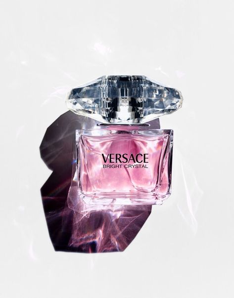 Bright Crystal perfume by Versace was inspired by a mixture of Donatella Versace's favorite floral fragrances, Bright Crystal is a fresh, sensual blend of refreshing chilled yuzu and pomegranate mingled with soothing blossoms of peony, magnolia, and lotus flower, warmed with notes of musk and amber. Notes include Iced Accord, Yuzu, Pomegranate, Peony, Magnolia, Lotus Flower, Acajou, Vegetal Amber, Musk. Decant Perfume, Versace Perfume, Fragrance Photography, Versace Bright Crystal, Bright Crystal, Perfume Photography, Still Life Photographers, Perfume Samples, Perfume Scents