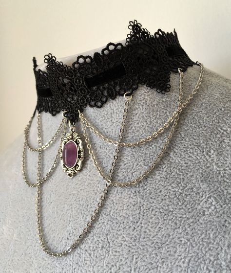 Black lace and velvet gothic choker featuring a silver chains design and an amethyst gem pendant in the middle. Lace is 4cm in the widest part. This piece fastens with a clasp and 5cm chain at the back. It is to fit neck sizes from 12 to 14.7 inches (31-36cm). If these measurements do not fit you, send me your measurements with your order. This choker is light and not heavy on th...#Timeless #the #A #Exploring #Fashion #Statement #of #the #Allure #The #of #Art #of #Choker #Tidiness #Necklaces Chains Design, Gothic Choker Necklace, Gothic Choker, Goth Choker, Black Lace Choker, Gem Pendant, Choker Necklace Designs, Grunge Jewelry, Metal Choker