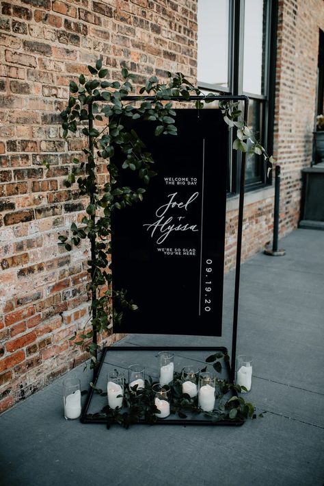 Event Signage 2023 Modern Wedding Trends, Industrial Wedding Welcome Sign, Venue Color Scheme, Sage Green And Black Centerpieces, Industrial Wedding Signage, Modern Wedding Altar Ideas, Black And Green Engagement Party, White And Dark Green Wedding Flowers, Alternative Table Centerpieces