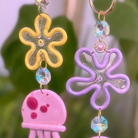 Kelsie Acosta on Instagram: "Jellyfish suncatchers! I really wanted the flowers to look like bubble blowers and I think I succeeded?!? 😬 more on its way ^.^ #spongebob #spongebobmemes #spongebobsquarepants #jellyfish #bubbleblowing #bikinibottom #handmade" Spongebob Jellyfish, Jellyfish Drawing, Jellyfish Craft, Spongebob Memes, Painting Class, Clay Charms, May 7, Fall 2024, The Flowers