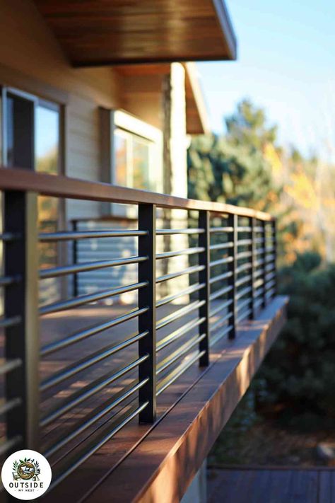 Modern horizontal slats mix wood and metal for a stylish, durable railing. See more here! Railing Fence Ideas, Horizontal Balcony Railing, Modern Exterior Stair Railing, House Front Railing Design, Railing For Patio, Metal Railing Deck, Rod Iron Deck Railing Ideas, Exterior Handrail Design, Horizontal Metal Railing