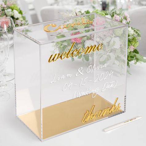 PRICES MAY VARY. ELEGENT WEDDING CARD BOX: This modern crystal-clear acrylic card box with gold mirror accents is a stunning decoration that captures your guests' attention while efficiently collecting gift cards, cash, checks, and small-sized gifts. HIGH QUALITY ACRYLIC: Crafted from premium 4mm thick cast acrylic with gold mirror prints of "cards, welcome, thanks." Large storage capacity holds 80-100 cards. Measurements: 10x10x5.5 inches. Slide-off top lid with a 7-inch slot. Securely packed w Gift Card Box Wedding, Box For Cards At Party, Sweet 16 Card Box Ideas, Quince Box Card Holders, White Acrylic Card Box Wedding, Clear Acrylic Card Box Wedding, Acrylic Cards And Gifts Sign, Black Acrylic Card Box Wedding, Gold Card Box