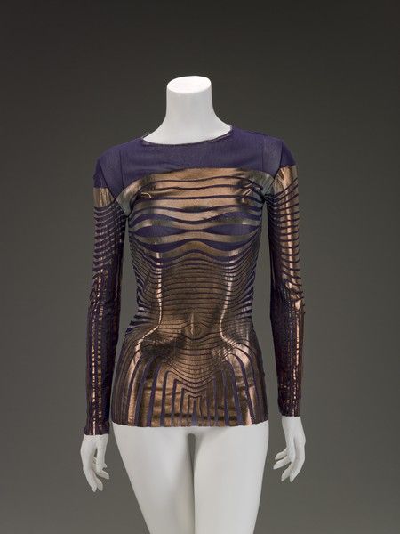 Jean Paul Gaultier (French, 1952-) creation date 1996 materials nylon mesh; design in metallic foil/paint Jean Paul Gaultier 90s, Jean Paul Gaultier Haute Couture, Dystopian Fashion, Blouse Designer, Punk Inspiration, Festival Style, Metallic Foil, Mesh Design, Paul Gaultier