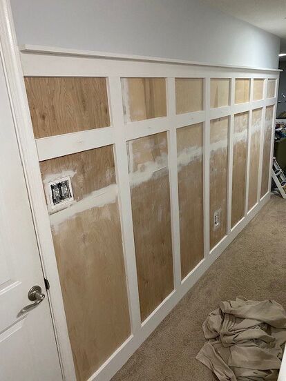 We needed a solution for hanging our coats and this long wall in our entryway was the perfect solution! Before Here are the measurements of our board and batten layout (not to scale).160.44" (length of wall) - 28" = 132.44"132.44" / 7 (the # of spaces between the 8 boards) = 18.92"18.92" spacing between each batten board Step 1: Remove the bottom baseboard.Step 2: Attach the .25 x 2 x 4" birch plywood across the whole wall (edges are made to line up with batten to cover lines)… Thick Board And Batten Wall, Board And Batten Wall Tutorial, Board And Batten Measurements, Board And Batten Spacing, Shaker Wainscoting, Board And Batten Ideas, Board And Batten Hallway, Board Batten Wall, Modern Wainscoting