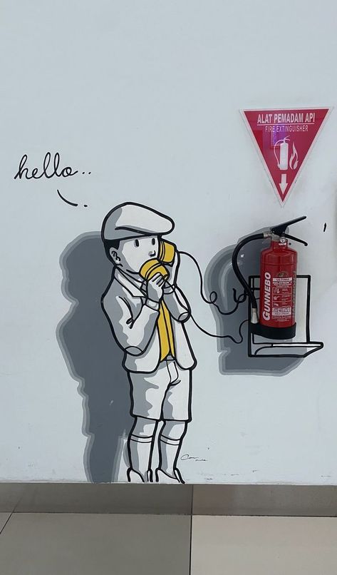 The boy speaks to the paper cup, but he listens to himself on the other end of the line.  What a silly way to communicate!

Fire extinguisher marking Fire Extinguisher Ideas, Hallway Colours, Wall Art Diy Paint, Coffee Shops Interior, Fire Extinguishers, Make Believe, Line At, Fire Extinguisher, Make Things