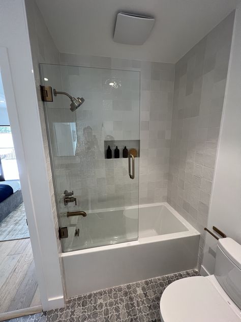 Roman Bathtub Shower Combo, Small Bathroom Remodel Bathtub, Bathroom With Standard Tub, Modern Bathroom Design Tub, Bathroom Remodel With Tub Bath Tiles, Nice Tub Shower Combo, Long Bathtub Shower Combo, Square Tub Shower Combo, Soaker Tub With Tile Surround