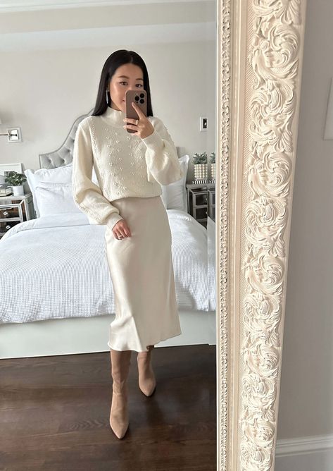 Sweater Silk Skirt Outfit, Slip Skirt Outfit Winter, Silk Skirt Outfit Winter, Silk Skirt And Sweater, Cream Skirt Outfit, Satin Skirt Outfit Winter, Cream Boots Outfit, Satin Skirt Outfit Classy, Skirt Boots Outfit