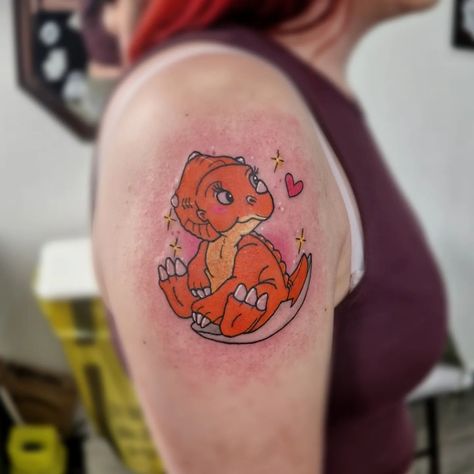 Cera from Land before time for todays client. #tattoostudio #tattoo #tattoos #tattooartist #inked #tattooart #tattooshop #tattooed #tattoolife #tattooing #art #tattooist #tattooink #tattooer #tattoodesign #tattoostyle #tattooideas #tattoolove #instatattoo #artist #flashworker #tattoomodel #tattooinspiration Land Before Time Tattoo, Little Foot Tattoos, Disney Sleeve Tattoos, Minimal Tattoo Designs, Minimal Tattoo Ideas, Dinosaur Tattoos, The Land Before Time, Movie Tattoos, Land Before Time