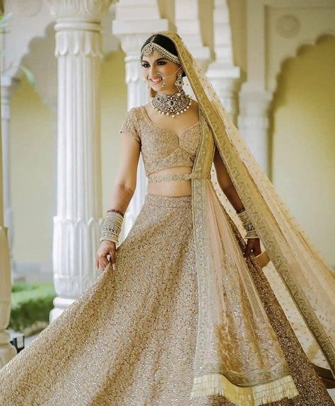 Simple yet elegant beige bridal lehenga for wedding.  #bridallehenga #metalliclehenga #weddingwear #weddingoutfit #bridaloutfit #bridalwear #brides2019 #heavylehenga #elegantlehenga #shaadisaga Golden Bridal Lehenga, Manish Malhotra Lehenga, भारतीय दुल्हन संबंधी, Golden Lehenga, Brown Clothes, डिजाइनर कपड़े, Bridal Lehenga Designs, Latest Bridal Lehenga, Wedding Ceremony Ideas