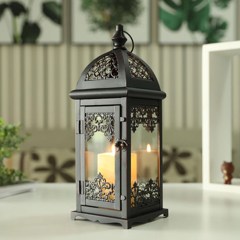 VINTAGE METAL CANDLE LANTERN - The life-size vintage candle lantern, with glass panes, special top and pattern frame distressed by white powdering UNIVERSAL SIZE FOR MOST OCCASION- Uses tea-light, real candles, votive or small pillar candles up to 3" x 4". 5.5" x 5.5" x 15" tall.Iron and glass.VERSATILE & PORTABLE - A hanging ring for easy hanging, or sits on a flat surfaceLightweight (2.1lbs), convenient to carry around TEMPERED GLASS PANES & DURABLE METAL Four clear tempered glass panes Large Floor Lanterns, Metal Candle Lanterns, Floor Lantern, Alcohol Lamp, Electronic Candles, Candle Types, Lantern Candle Decor, Candle Lantern, Lantern Design