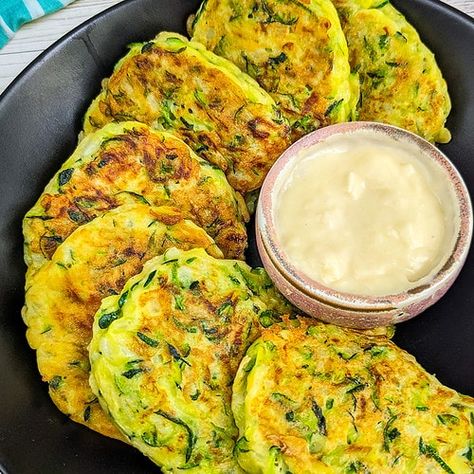 Enjoy simple and flavorful 4-Ingredient Zucchini Fritters! Made with shredded zucchini, flour, egg, and onion. Versatile and delightful as a snack or appetizer. Get creative with herbs and spices! Shredded Zucchini Recipes, Fried Fritters, Corn Zucchini, Zucchini Quiche, Canned Salmon Recipes, Zucchini Banana, Zucchini Banana Bread, Easy Zucchini Recipes, Empanadas Dough