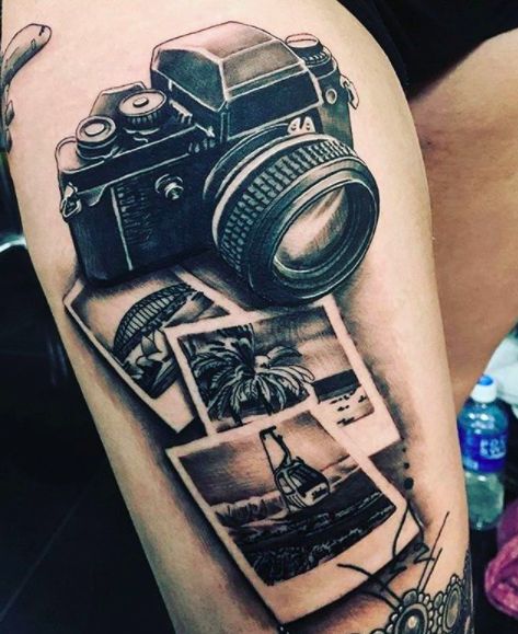 CafeMom.com : Picture Perfect Travel Tattoo : 40 Travel Tattoos That Will Give You Serious Wanderlust -- This Polaroid camera is an amazing idea for travelers who love to take pictures. If you look closely, each photo has a different location illustrated in it. This could be a fun way to remember multiple places you've been. More from CafeMom: 16 Epic Best Friend Tattoos for You & Your Soul Sister Tattoo Traveling, Polaroid Tattoo, Photography Tattoos, Camera Tattoos, Camera Tattoo, Shape Tattoo, Tattoo Photography, Dad Tattoos, Detailed Tattoo