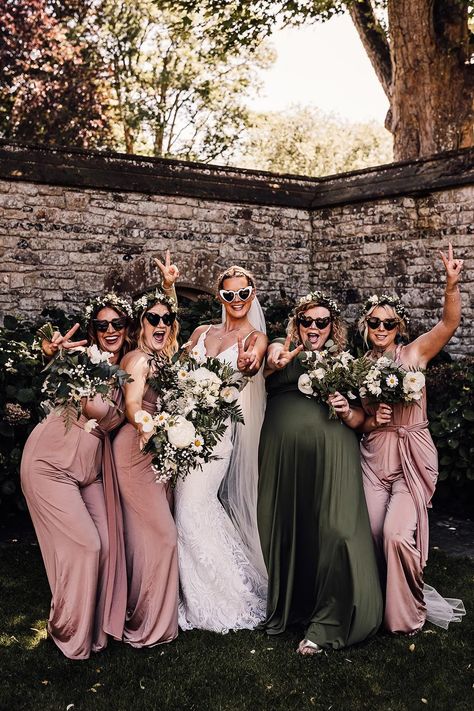 Bridal party in white heart shaped sunglasses, a lace wedding dress and pink and green bridesmaid dresses Bridesmaid Dresses Sage Green And Blush, Dark Green And Pink Bridesmaid Dresses, Pink Green Bridesmaid Dresses, Bridesmaid Flower Dresses, Sage Green Dusty Blue Blush Pink Bridesmaid Dresses, Green And Blush Bridesmaid Dresses, Sage And Pink Bridesmaid Dresses, Sage Green And Blush Pink Bridesmaid Dresses, Wedding Colors Pink And Green