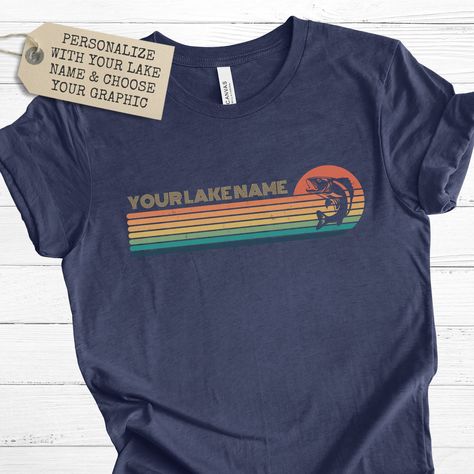 "Personalized lake t-shirt! This vintage-inspired retro sunset design can be fully customized with your lake name and a special lake-themed graphic that best represents your lake life. This shirt is perfect for a day out on the boat or a casual weekend at the cabin. A perfect gift for yourself or a loved one who loves the lake and sunsets.Always FREE SHIPPING within the United States! Available in 8 colors: white, dark grey heather, heather navy, natural, heather slate, army, heather peach and m Lake Life Shirt, Lake Names, Friends T Shirt, Sunset Design, Sunset Lake, Retro Sunset, Lake Sunset, Friends Tshirt, Casual Weekend