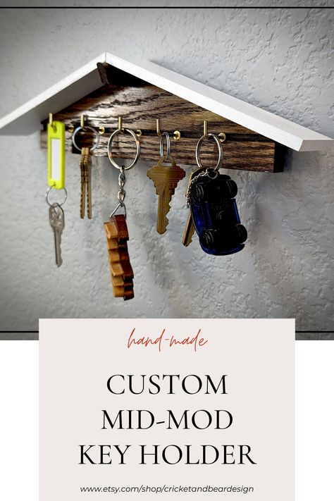 This new design is an instant classic. We took our popular dove house design and applied it to a key holder. This modern wall decor will be the highlight of your room. It is handcrafted in our small shop using upcycled oak and poplar. The stain is dark walnut and the hooks are bronze to complete the mid-century modern look. This wall key holder is finished with a gloss urethane coating to protect it from wear and tear. Mid Century Modern Key Holder, Modern Key Holder, Home Decor Minimal, Entryway Key Holder, Dove House, Minimal Wall Decor, Key Holder For Wall, Decor Minimal, Wall Key Holder