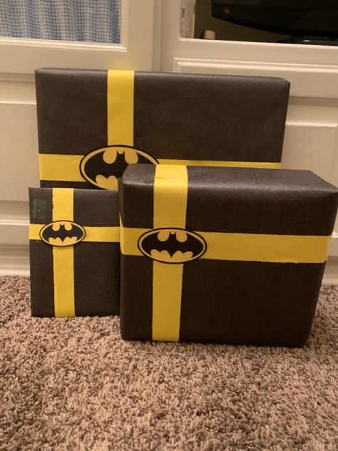 It was very simple I used black wrapping paper and cut yellow paper into strips printed the logo I found on Pinterest and taped it all together. My boyfriend absolutely love it and thought it was adorable. Batman Birthday Gifts For Boyfriend, Batman Presents For Him, Batman Tree Christmas, Batman Gift Wrapping Ideas, Batman Wrapping Ideas, Batman Bf Gifts, Cute Gift Wrapping Ideas For Boyfriend, Batman Themed Gifts For Boyfriend, Batman Basket For Bf