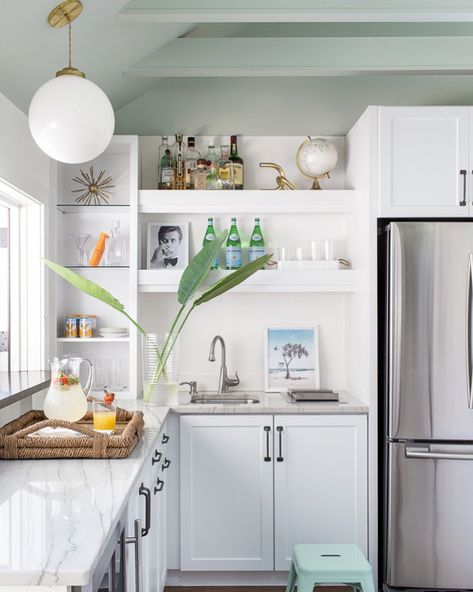 Time to take a peek inside a 300-square-foot pool house that feels—and functions as—so much more. There's the kitchenette and… Pool House Kitchen, White Subway Tile Backsplash, Beach House Kitchens, Interior Pictures, Coastal Kitchen, White Cabinetry, Chic Kitchen, White Kitchen Cabinets, White Cabinets