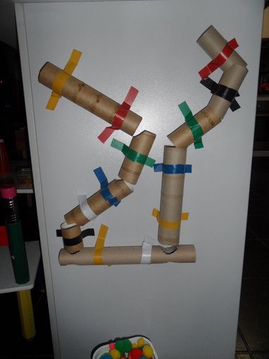 Simple pom pom tunnel - would be great for centers/free draw area. Put magnets on tubes with a board painted with magnetic paint.  Great for problem solving and fine motor skills Tubes And Tunnels, Magnetic Paint, Puff Balls, Free Draw, Indoor Recess, Magnetic Whiteboard, Force And Motion, Creative Curriculum, Steam Activities