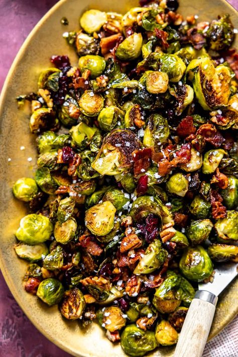 These easy to make Roasted Brussels Sprouts with Bacon come together with 10 minutes of prep time. The roasted brussels sprouts are paired with crispy bacon, toasted pecans and sweet dried cranberries, all coated in a maple dijon sauce. A perfect show stopping side dish for any meal! Brussel Sprout Side Dish, Maple Brussel Sprouts, Maple Bacon Brussel Sprouts, Yeast Pizza Dough, House Of Yumm, Roasted Brussels Sprouts With Bacon, No Yeast Pizza Dough, Dijon Sauce, Crispy Brussel Sprouts