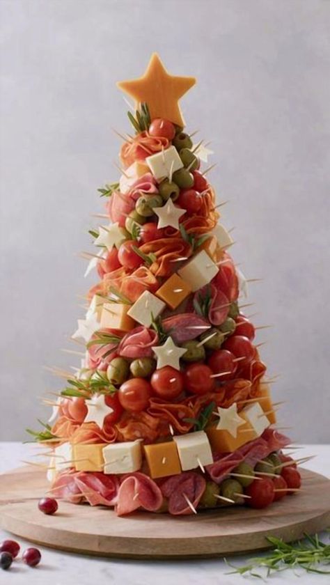 Elevate your holiday celebrations with a stunning festive charcuterie tree that’s sure to impress your guests. This creative twist on the classic charcuterie board combines a delightful assortment of meats, cheeses, fruits, and nuts, artfully arranged to resemble a charming Christmas tree. Perfect as a centerpiece for your holiday gatherings, this edible masterpiece not only looks beautiful but also offers a delicious variety of flavors and textures. Whether you're hosting a cozy family dinner or a lively holiday party, this charcuterie tree is a showstopper that brings joy and taste to the table. Christmas Decor Small Apartment, Aldi Party Food, Charcuterie Christmas Tree, Cheese Christmas Tree, Charcuterie Tree, Christmas Party Food Appetizers, Food Christmas Tree, Charcuterie Christmas, Party Food Christmas