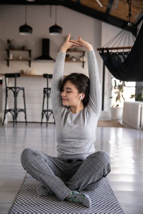 Ethnic woman in earbuds sitting in Lotus pose at home · Free Stock Photo Emotional Burden, Science Of Happiness, Lotus Pose, Abdominal Fat, Living A Healthy Life, Best Yoga, Management Tips, Relaxing Music, Lose Belly