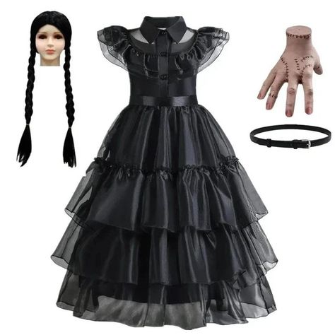 Wednesday Addams Kids Cosplay Dress Snap! Crackle! Pop! This Halloween reveal your inner demonic side with Wednesday Addams cosplay outfit because It's Wednesday Addams time of the year! 👻🖤 This dress features a classic black silhouette with ruffles and a belt, plus a wig with braids to complete the costume. Add the included hand prop to complete your Wednesday Addams look! 👻 Our kid's cosplay dress for Halloween is perfect for channeling your inner goth queen. 🖤 Shop now and get ready to sla... Wednesday Birthday Party Ideas, Wednesday Dresses, Addams Outfit, Wednesday Birthday Party, Black Wednesday, Wednesday Addams Cosplay, Wednesday Costume, Wednesday Birthday, Black Gothic Dress