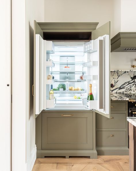 Green kitchen integrated fridge in Earl's Court designed by Herringbone Where To Put Fridge In Kitchen, Hidden Fridge Kitchen, Fridge In Kitchen, Hidden Fridge, Cape Cod Kitchen, Dark Blue Kitchens, Fridge Kitchen, Wooden Island, Earls Court