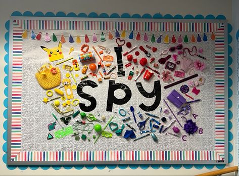 I used a mix of hot glue and staples to put together my I Spy interactive bulletin board. This will be a great incentive for students to play while lining up or before leaving speech therapy. Aba Bulletin Board Ideas, Sensory Room Bulletin Board Ideas, Special Ed Bulletin Boards, Sensory Bulliten Board, Ispy Bulletin Board Ideas, Learning Bulletin Board Ideas, Intervention Room Bulletin Board, Speech Room Bulletin Boards, Sensory Bulletin Board Ideas